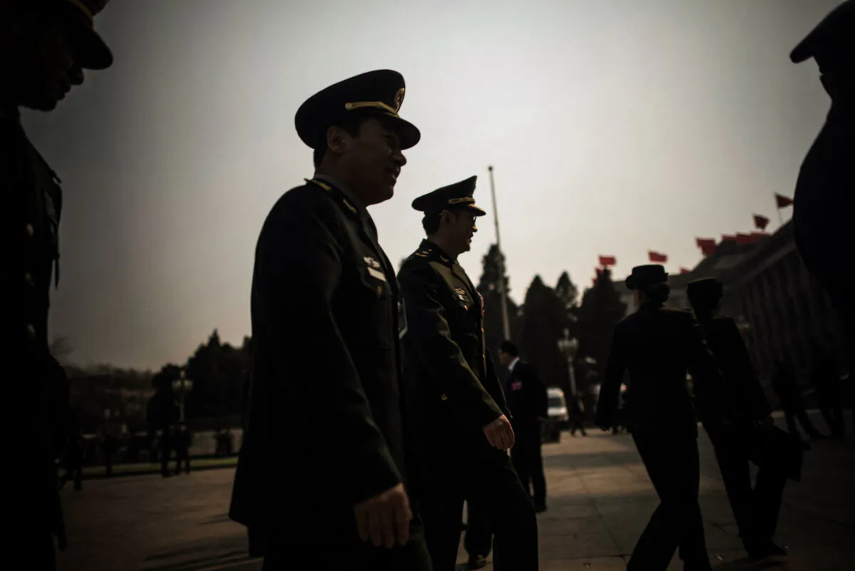 Military delegates arrive for the third plenary session of the Chinese People's Political Consultative Conference in Beijing on March 10, 2018. (Fred Dufour/AFP via Getty Images)