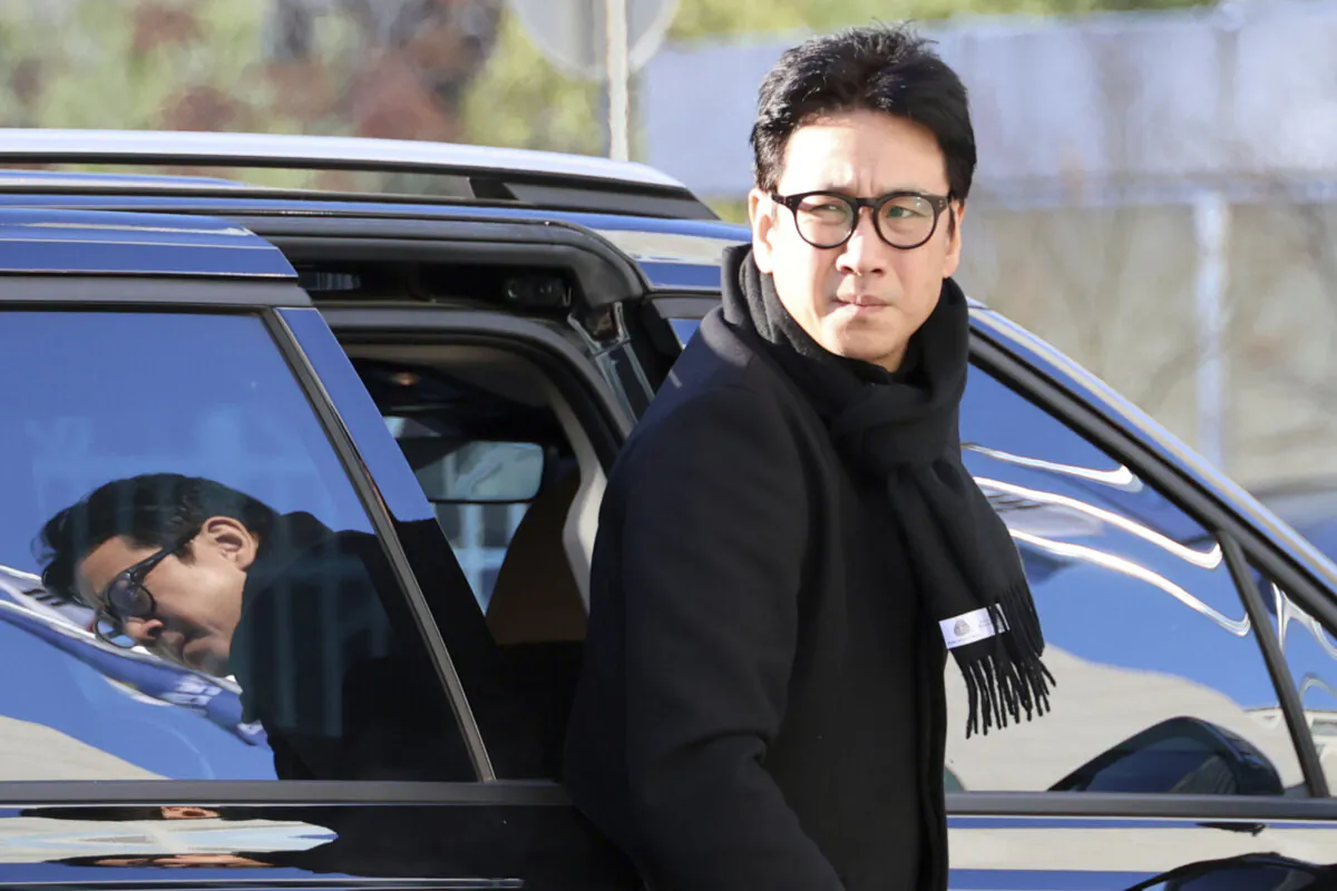 Actor Lee Sun-kyun gets off a car upon his arrival at the Incheon Metropolitan Police in Incheon, South Korea, on Dec. 23, 2023. (Son Hyun-kyu/Yonhap via AP)
