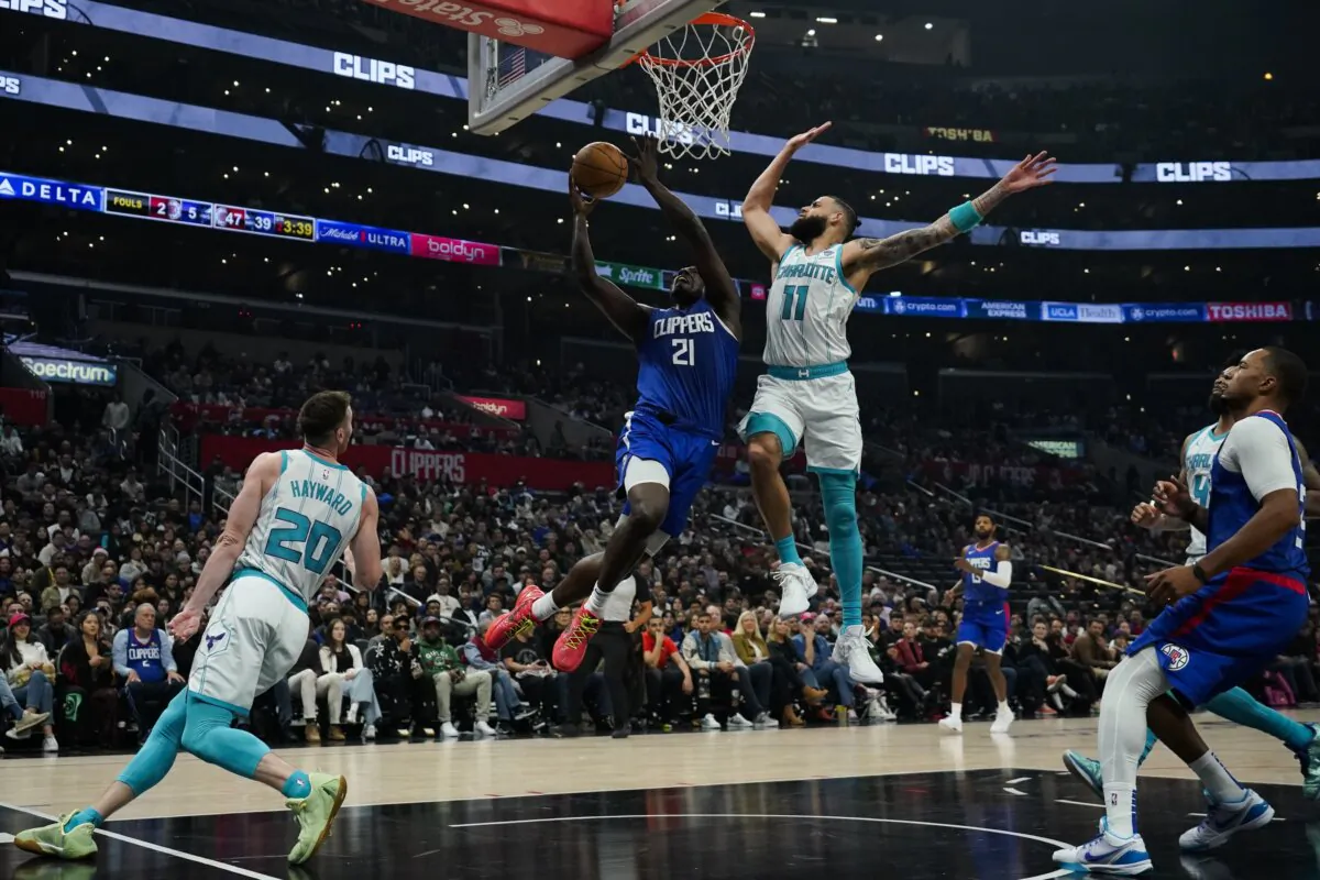 Los Angeles Clippers guard Kobe Brown (21) shoots against Charlotte Hornets forward Cody Martin (11) during the first half of an NBA basketball game in Los Angeles on Dec. 26, 2023. (Ashley Landis/AP Photo)