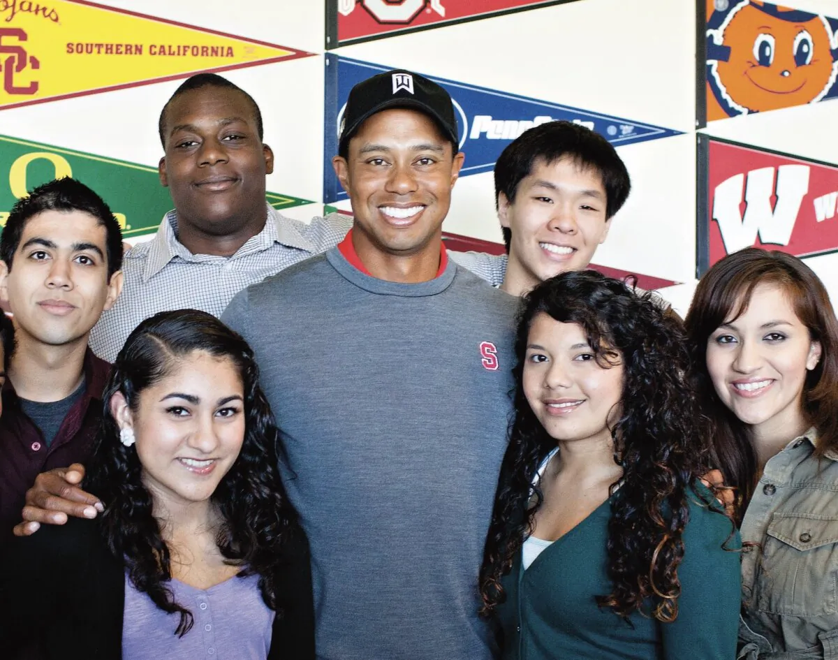 Tiger Woods with the 2011 cohort of Earl Woods scholars, who receive financial aid, mentoring, and other support for their post-high school careers. (Courtesy of TGR Foundation)