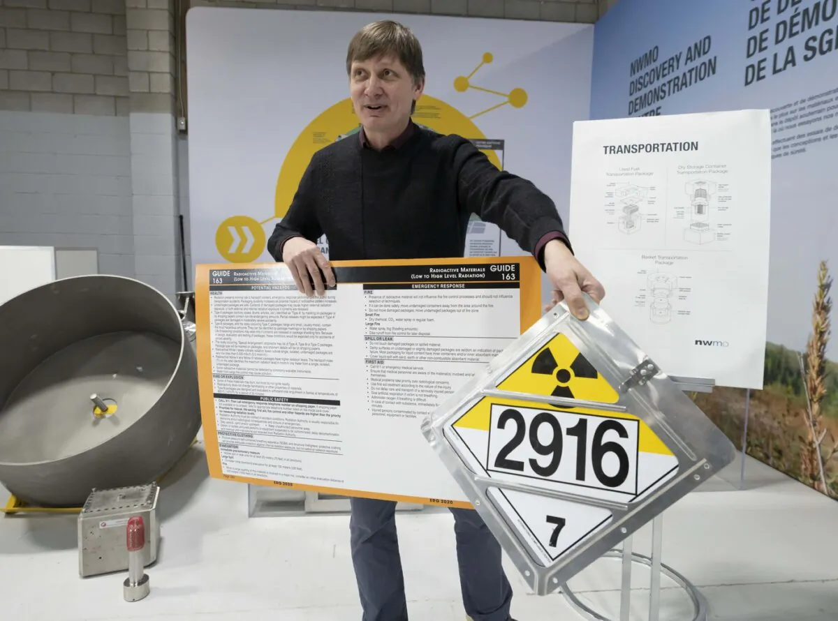 Nuclear Waste Management Organization senior transportation engineer Ulf Stahmer explains transportation signage for waste uranium during a tour of NWMO's facility in Oakville, Ont., on Dec. 12, 2023. (The Canadian Press/Frank Gunn)