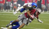 Bean Throws for 6 TDs, Kansas Overcomes Flags to Beat UNLV 49–36 in Guaranteed Rate Bowl