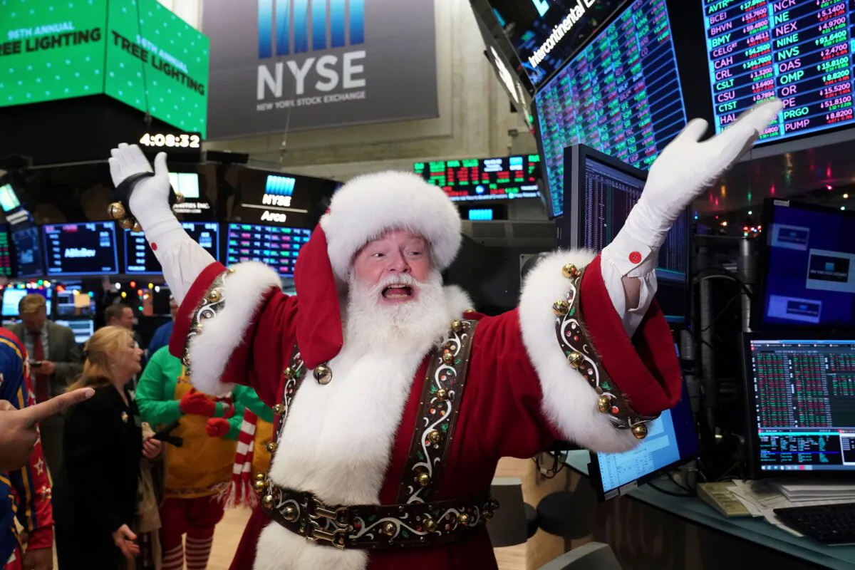 Santa Claus gestures on the floor at the closing bell of the Dow Industrial Average at the New York Stock Exchange in New York, on Dec. 5, 2019. (Bryan R. Smith/AFP via Getty Images)