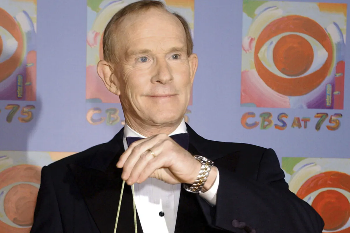 Tom Smothers does yo-yo tricks during arrivals at CBS's 75th anniversary celebration in New York on Nov. 2, 2003. (Louis Lanzano/AP Photo)
