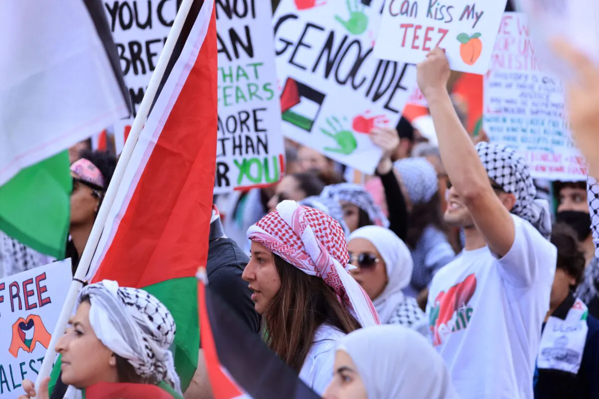 People carry banners and flags in support of the Palestinian people as thousands march through downtown Los Angeles on Oct. 28, 2023. (David Swanson/AFP via Getty Images)