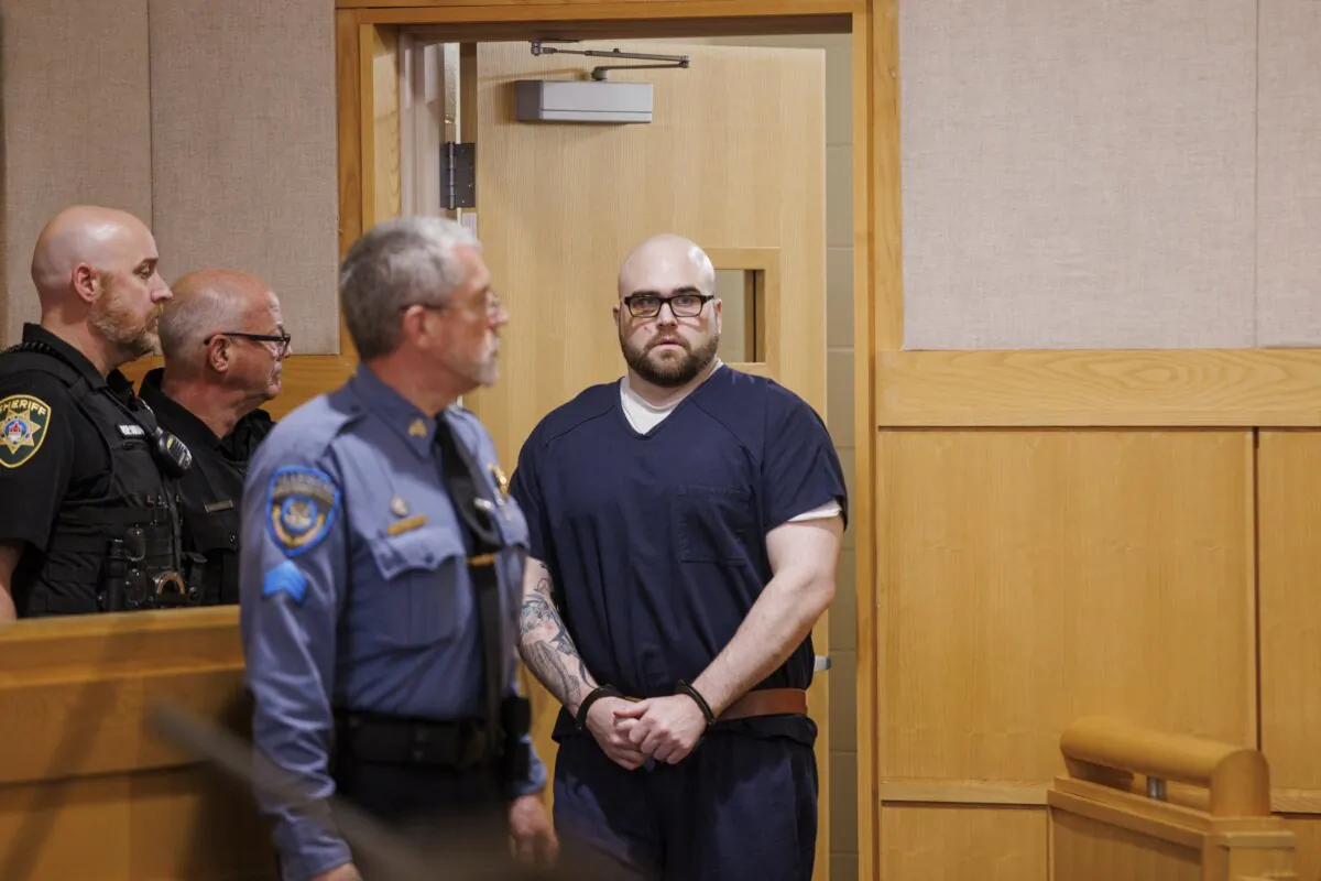 Joseph Eaton walks into a courtroom at West Bath District Court for his arraignment on July 28, 2023. (Brianna Soukup/Portland Press Herald via AP, Pool)