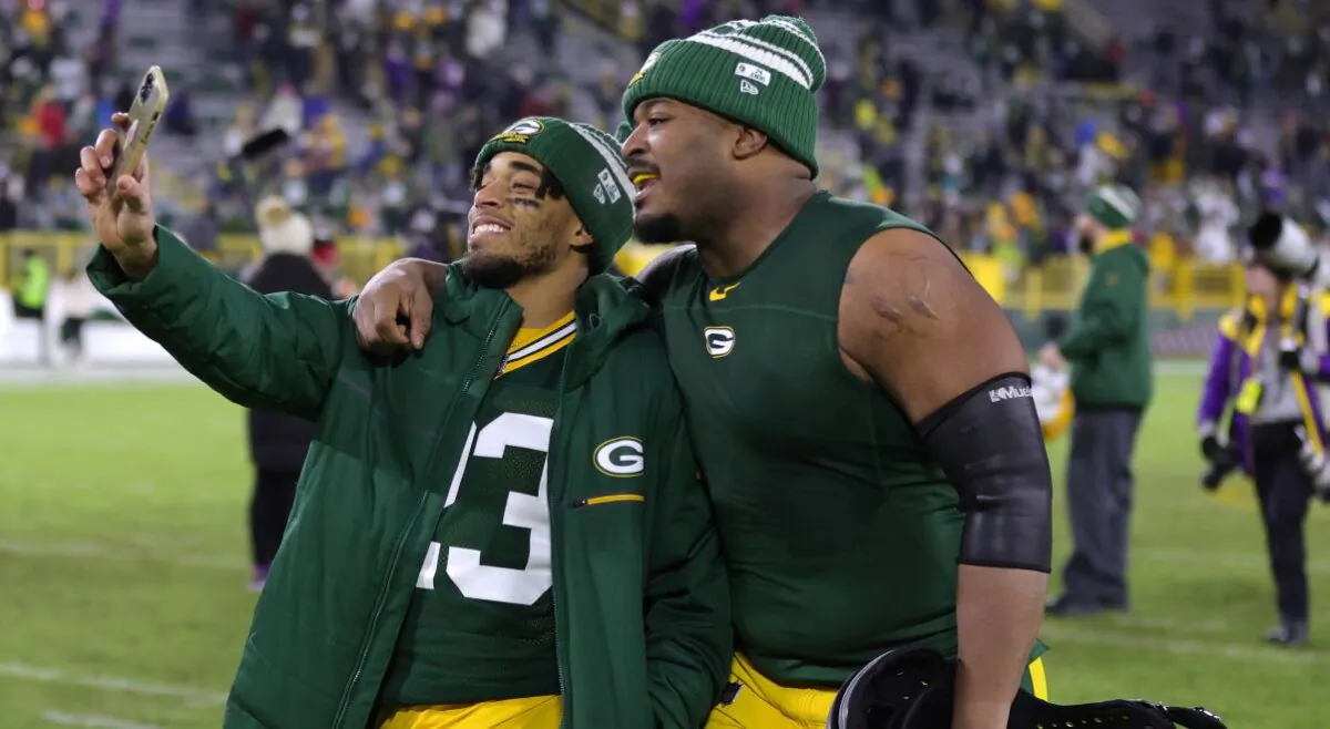 Jaire Alexander #23 (on left) of the Green Bay Packers celebrates after the game against the Minnesota Vikings at Lambeau Field on January 01, 2023 in Green Bay, Wisconsin. (Photo by Stacy Revere/Getty Images)
