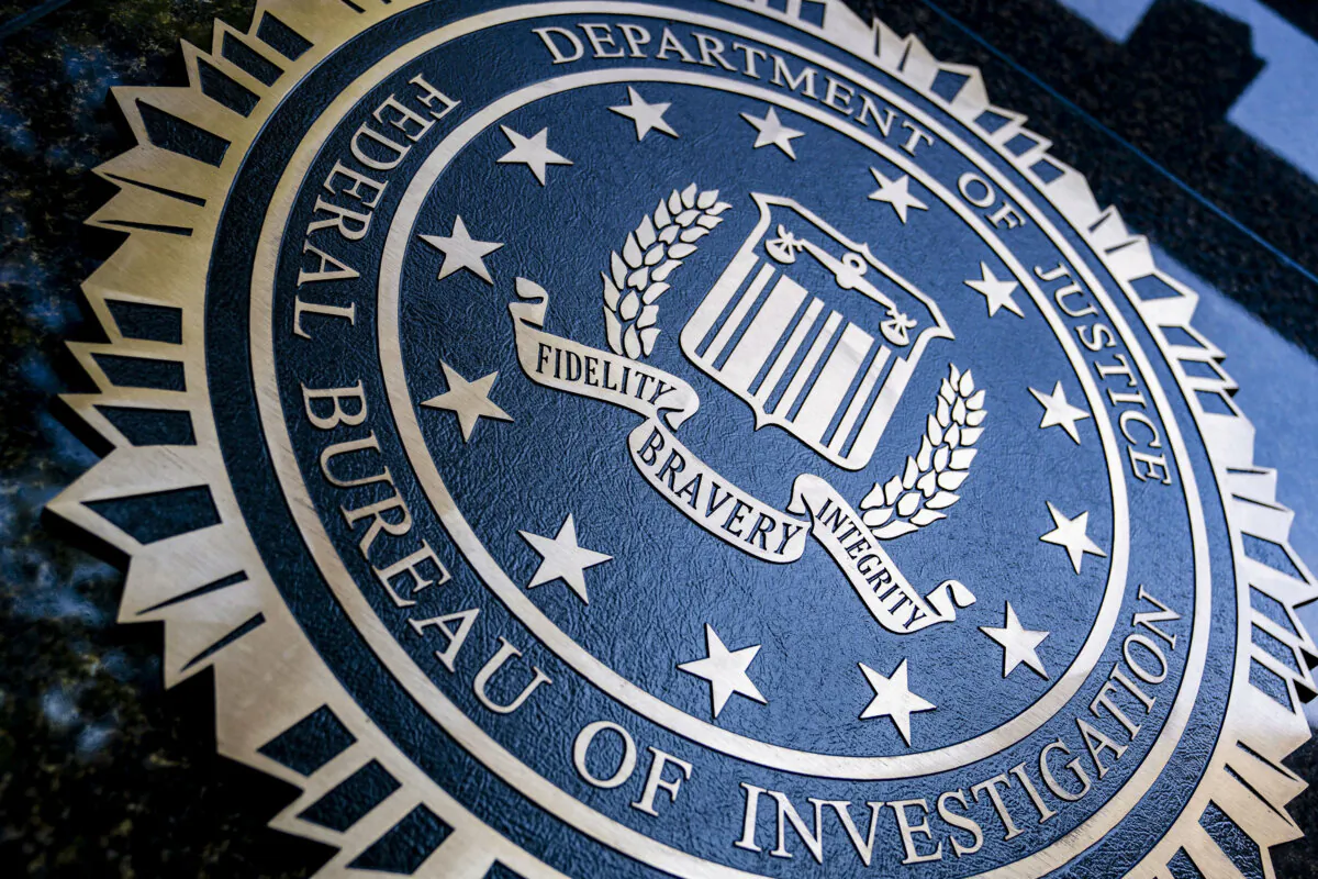 A seal reading "Department of Justice Federal Bureau of Investigation" is displayed on the J. Edgar Hoover FBI building in Washington, D.C., on Aug. 9, 2022. (Stefani Reynolds/AFP via Getty Images)