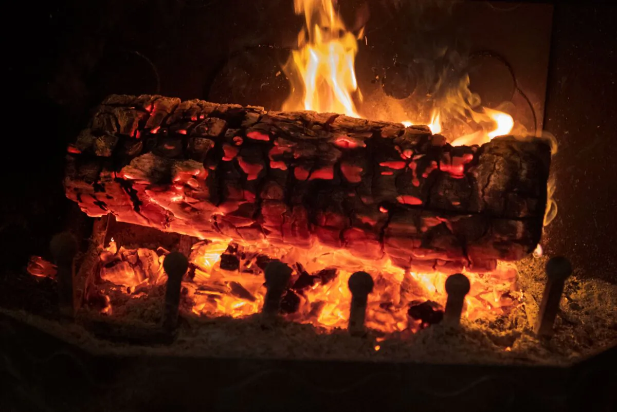 A log burning in a fireplace in a file image. (Fred Tanneau/AFP via Getty Images)