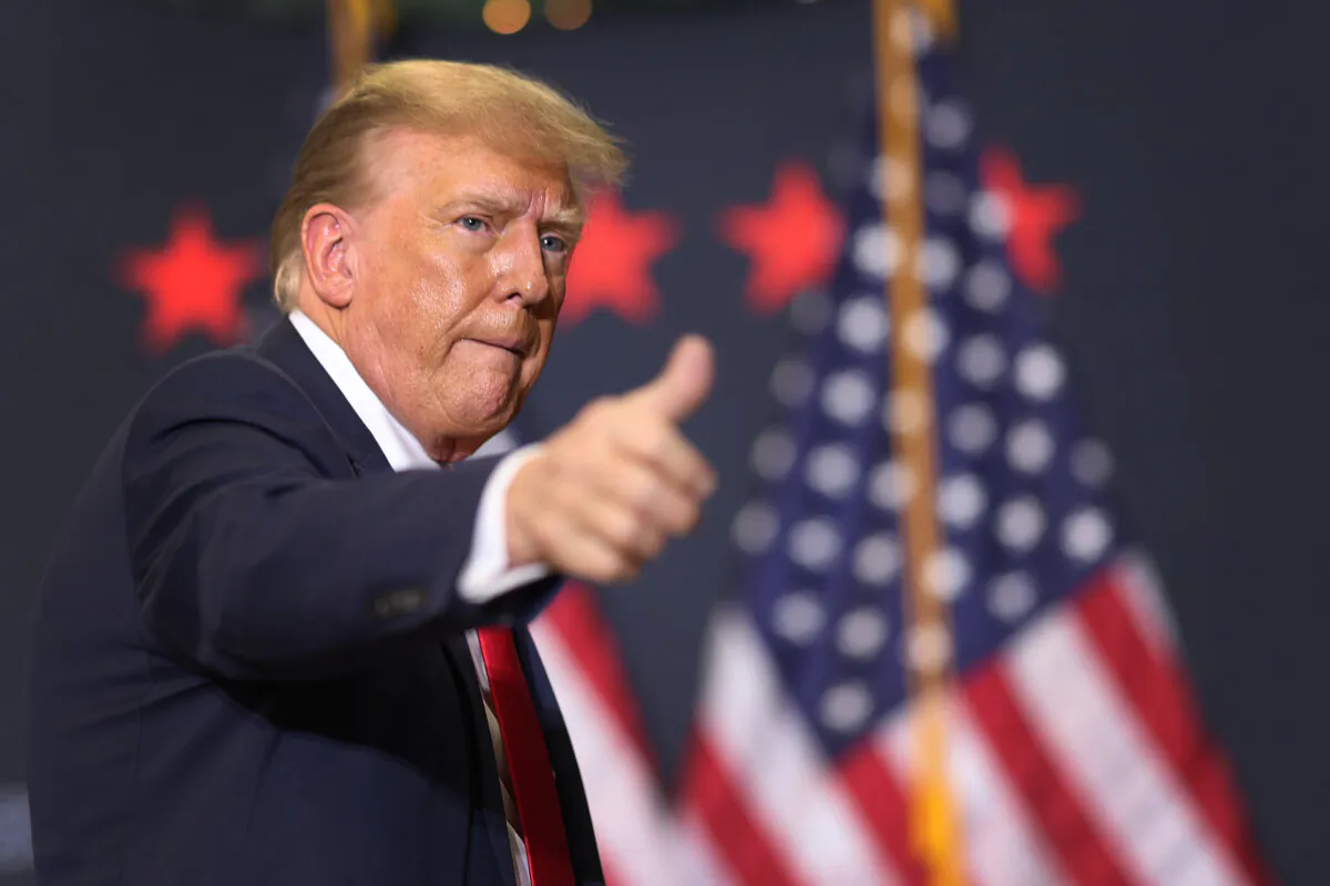 Republican presidential candidate and former U.S. President Donald Trump gestures as he leaves a campaign event in Waterloo, Iowa, on Dec. 19, 2023. (Scott Olson/Getty Images)