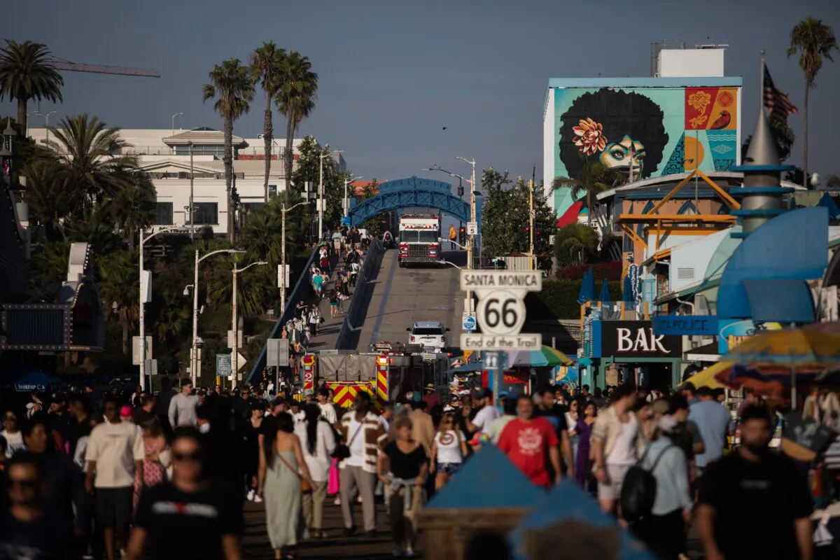 Fire trucks sit at Santa Monica Pier after a man, who claimed to have a bomb, climbed the ferris wheel and refused to come down, before he was ultimately taken into police custody, in Santa Monica, Calif., on Oct. 9, 2023. (Apu Gomes/AFP via Getty Images)