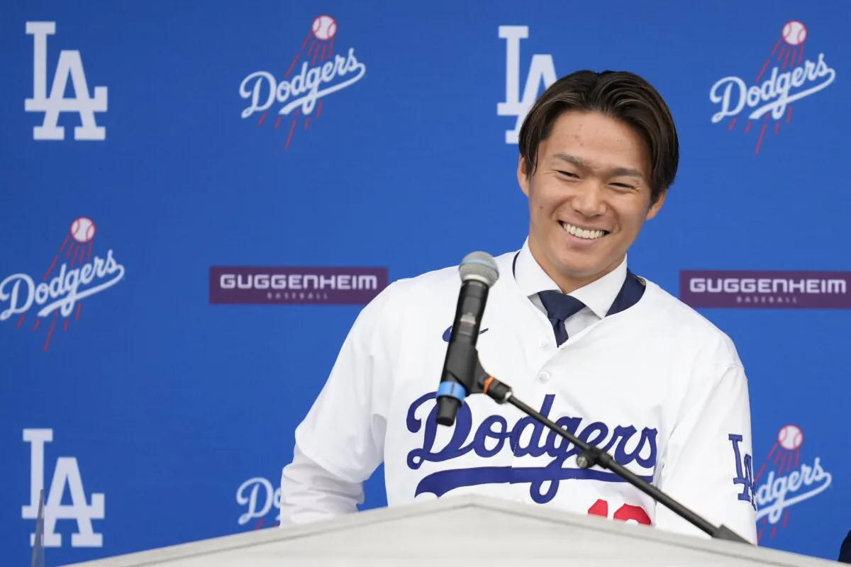 Yoshinobu Yamamoto smiles during his introduction as a new member of the Los Angeles Dodgers baseball team in Los Angeles on Dec. 27, 2023. (Ashley Landis/AP Photo)
