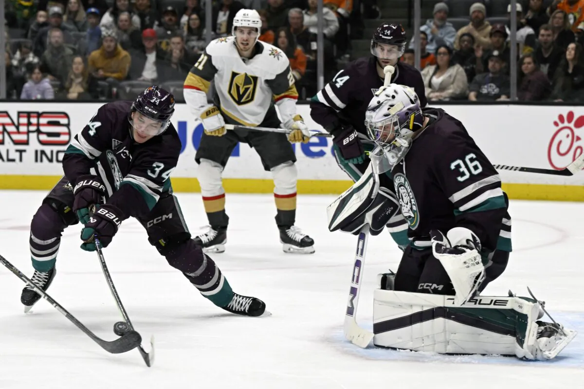 Anaheim Ducks defenseman Pavel Mintyukov (34) stops a shot with goaltender John Gibson (36) against the Vegas Golden Knights during the first period of an NHL hockey game in Anaheim, Calif., on Dec. 27, 2023. (Alex Gallardo/AP Photo)
