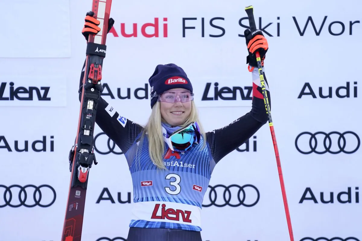 United States' Mikaela Shiffrin celebrates on the podium after winning an alpine ski, women's World Cup giant slalom race, in Lienz, Austria, on Dec. 28, 2023. (Giovanni Auletta/AP Photo)