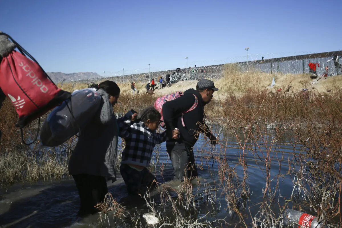 Illegal immigrants cross the Rio Grande river to reach the United States from Ciudad Juarez, Mexico, on Dec. 27, 2023. (Christian Chavez/AP Photo)