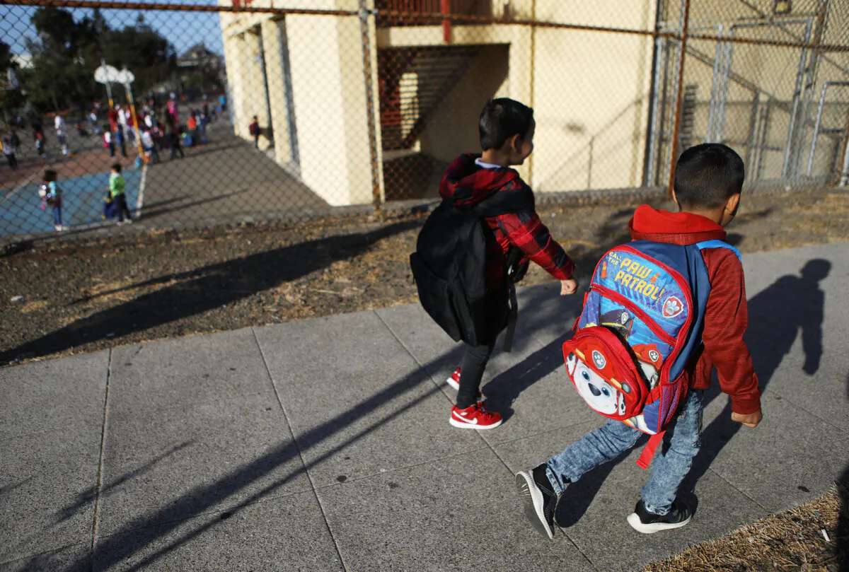 Children walk to school in Oakland, Calif., on Sept. 10, 2018. (Mario Tama/Getty Images)
