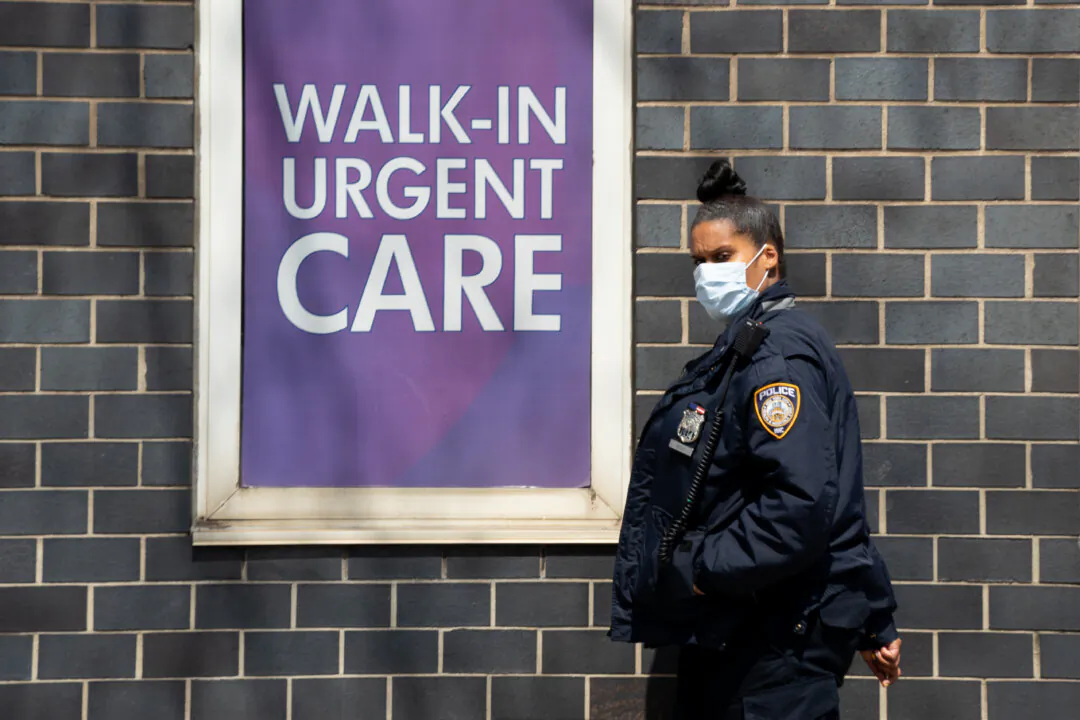 A hospital security guard wears a medical mask outside of Elmhurst Medical Center in Queens borough of New York City on April 15, 2020. (David Dee Delgado/Getty Images)