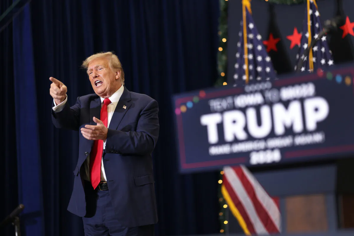 Republican presidential candidate and former U.S. President Donald Trump gestures as he wraps up a campaign event in Waterloo, Iowa, on Dec. 19, 2023. (Scott Olson/Getty Images)