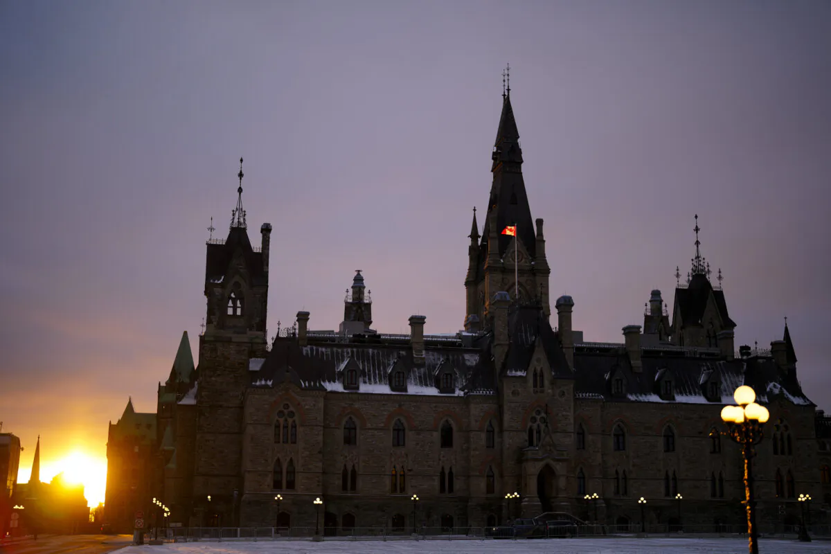 The West Block of Parliament Hill is pictured at sunset in Ottawa on Dec. 19, 2023. (The Canadian Press/Sean Kilpatrick)