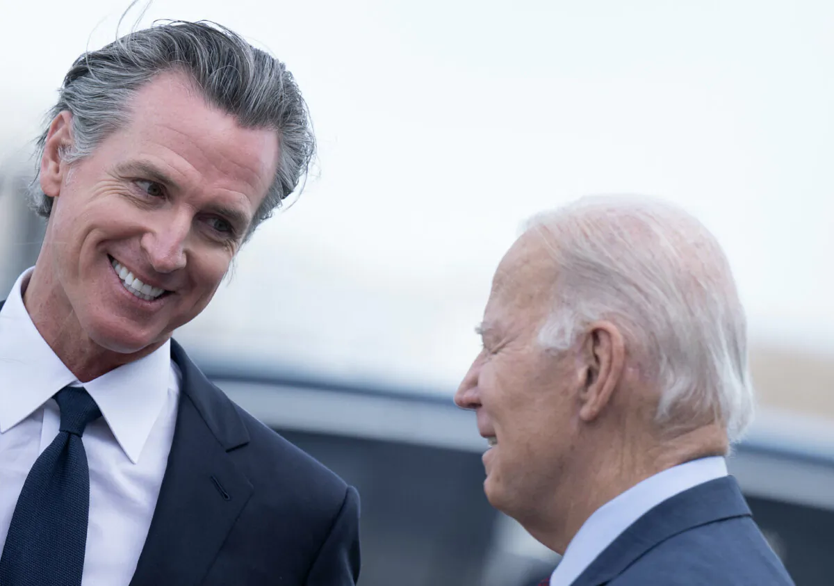 President Joe Biden (R) talks with California Gov. Gavin Newsom after disembarking Air Force One at San Francisco International Airport in San Francisco on Nov. 14, 2023. (Brendan Smialowski/AFP via Getty Images)