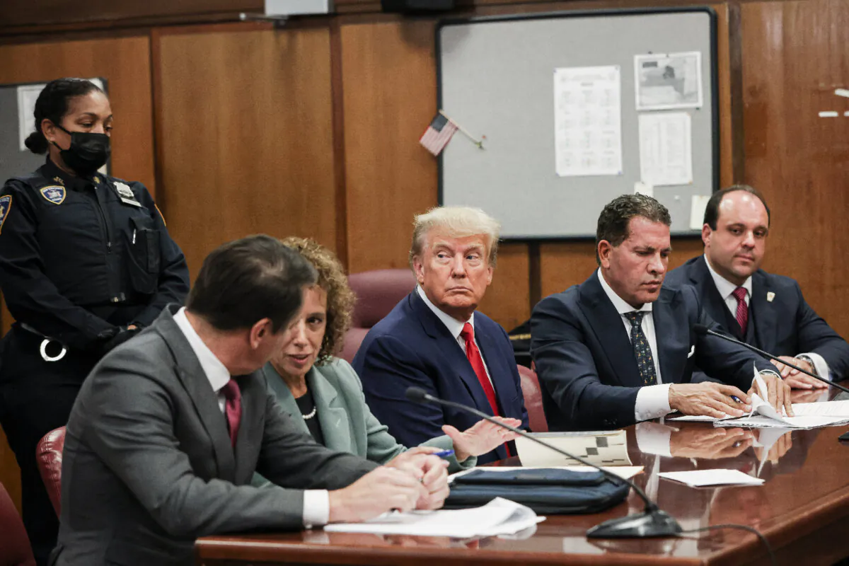: Former U.S. President Donald Trump sits in the courtroom with his attorneys (L-R) Todd Blanche, Susan Necheles, Joe Tacopina and Boris Epshteyn during his arraignment at the Manhattan Criminal Court April 4, 2023 in New York City.  (Photo by Andrew Kelly-Pool/Getty Images)