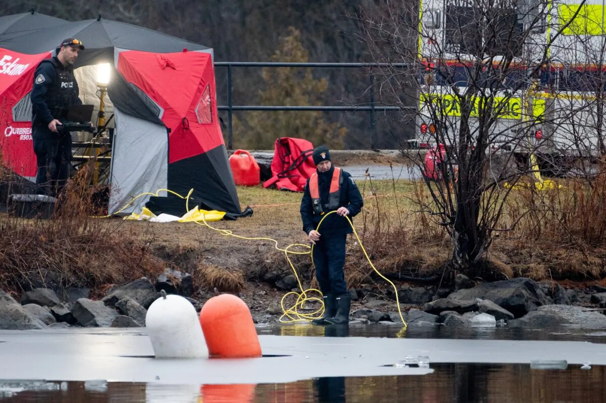 Members of the Ottawa Police Service Underwater Search and Recovery Unit conduct an underwater search on Dec. 28, 2023. (The Canadian Press/Spencer Colby)