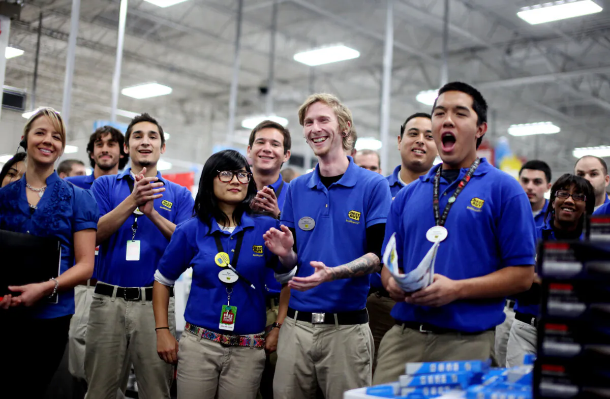 Employees do a cheer before the midnight opening at a Best Buy store San Diego on Nov. 24, 2011. (Sandy Huffaker/Getty Images)