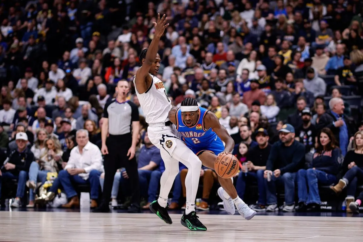 Oklahoma City Thunder guard Shai Gilgeous-Alexander (2) drives to the basket against Denver Nuggets forward Peyton Watson (8) in the second quarter Denver on Dec 29, 2023. (Isaiah J. Downing/USA TODAY Sports via Field Level Media)