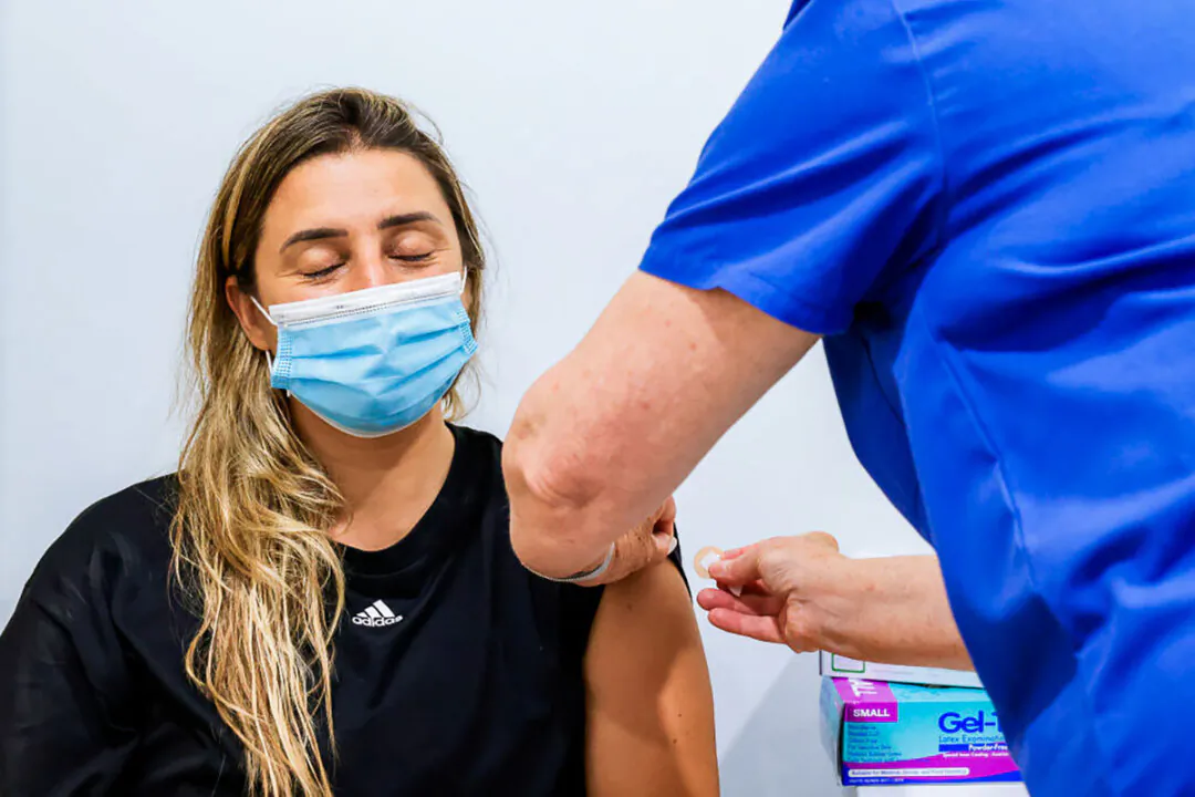 A woman receives a COVID-19 vaccine in Sydney, Australia on Jan. 10, 2022. (Jenny Evans/Getty Images)