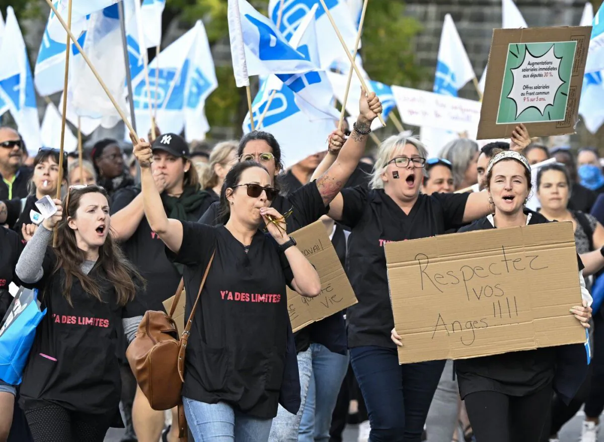 Union members of the Federation interprofessionnelle de la sante du Quebec (FIQ) march to the National Assembly to demonstrate, in Quebec City, Oct. 2, 2023. (The Canadian Press/Jacques Boissinot)