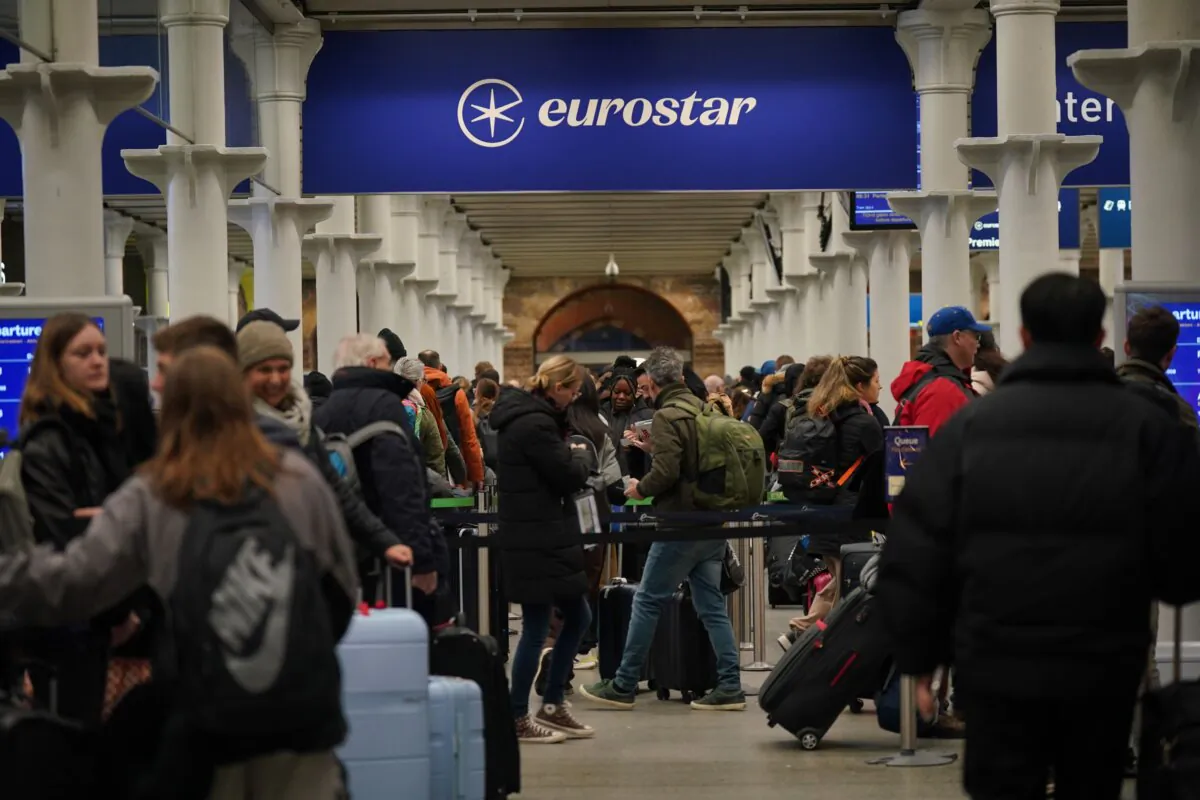 Passengers in line at the Eurostar terminal in St Pancras International station, central London on Dec. 31, 2023. (Yui Mok/PA)
