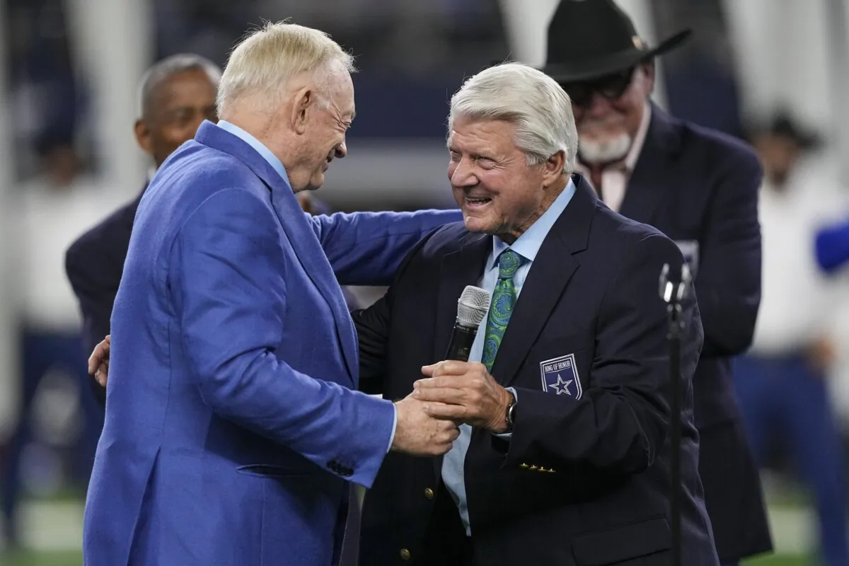 Dallas Cowboys owner Jerry Jones (L) talks with Jimmy Johnson after the former Cowboys coach was inducted into the team's ring of honor in Arlington, Texas, on Dec. 30, 2023. (Sam Hodde/AP Photo)