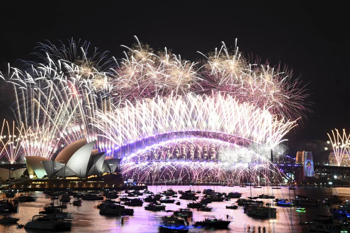 Fireworks explode over the Sydney Opera House and on the Harbour Bridge as part of New Year's Eve celebrations in Sydney on Jan. 1, 2024. (Dan Himbrechts/AAP Image via AP)