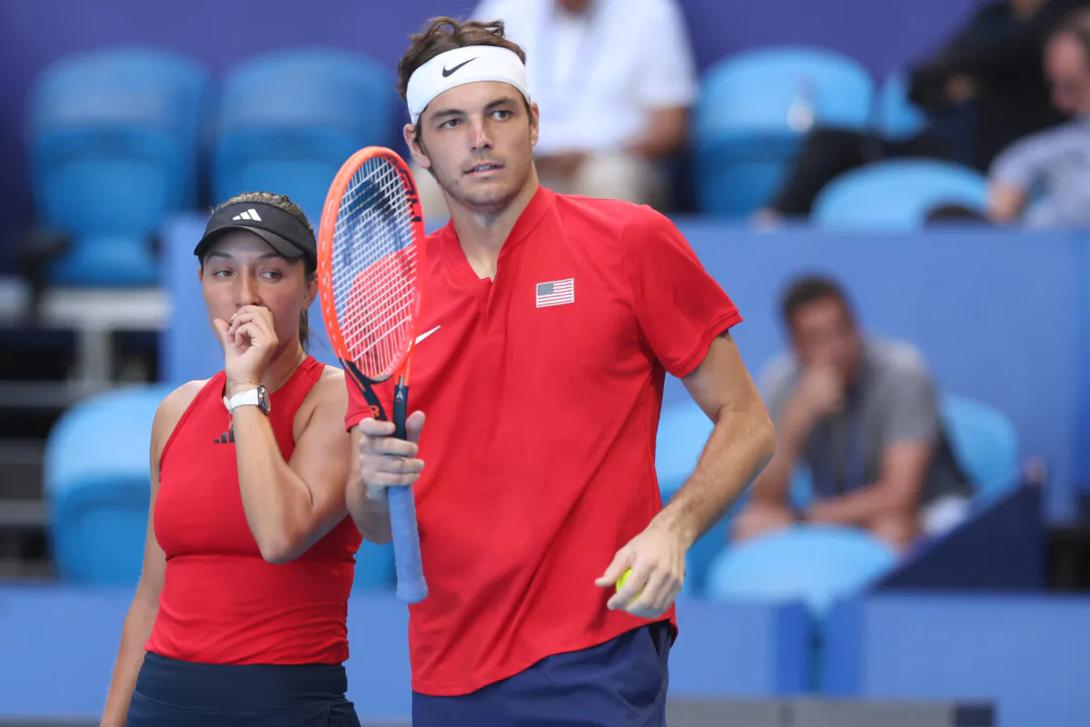 Jessica Pegula and Taylor Fritz of the United States talk tactics in the mixed doubles match against Katie Boulter and Neal Skupski of Great Britain during day three of the 2024 United Cup at RAC Arena in Perth, Australia, on Dec. 31, 2023. (Will Russell/Getty Images)