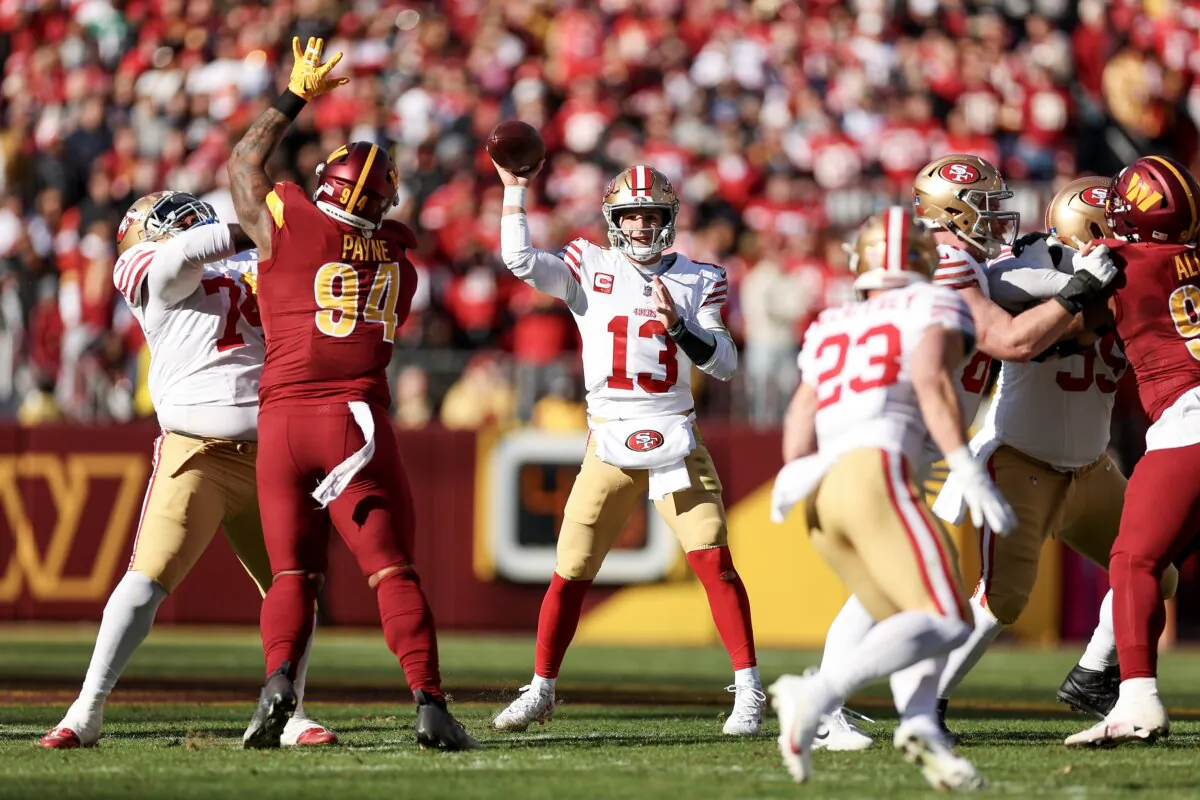 Brock Purdy (13) of the San Francisco 49ers throws a pass during the first quarter of a game against the Washington Commanders in Landover, Md., on Dec. 31, 2023. (Scott Taetsch/Getty Images)