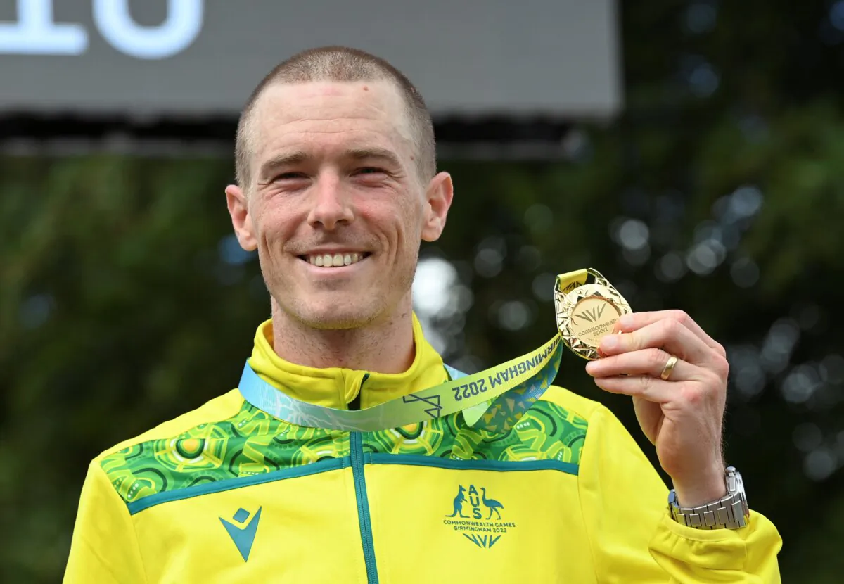 Gold medal winner Rohan Dennis of Australia poses with his medal after the men's cycling individual time trials at the Commonwealth Games in West Park, Wolverhampton, England, on Aug. 4, 2022. (Rui Vieira/AP Photo)