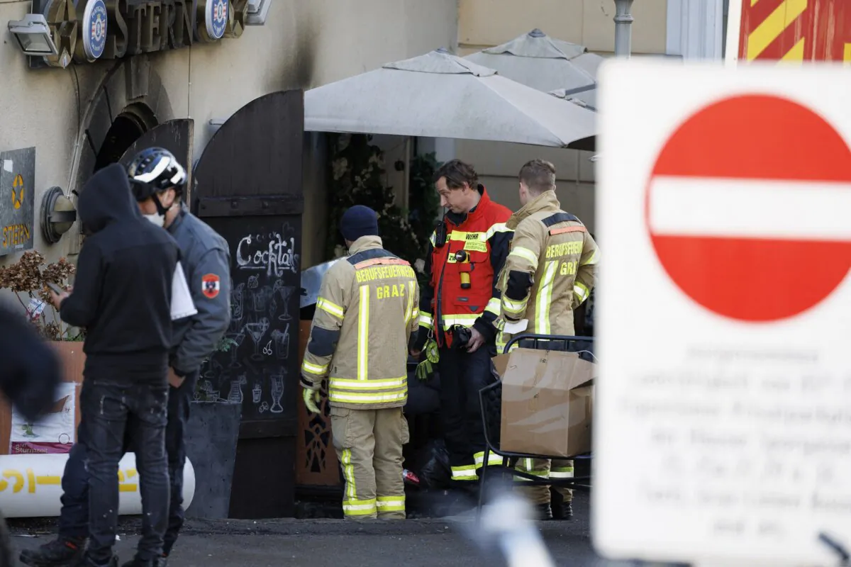Firemen are seen in front of a restaurant in Graz, Austria, on Jan. 1, 2024, after a fatal fire broke out on New Year's Eve. (Erwin Scheriau/APA/AFP via Getty Images)
