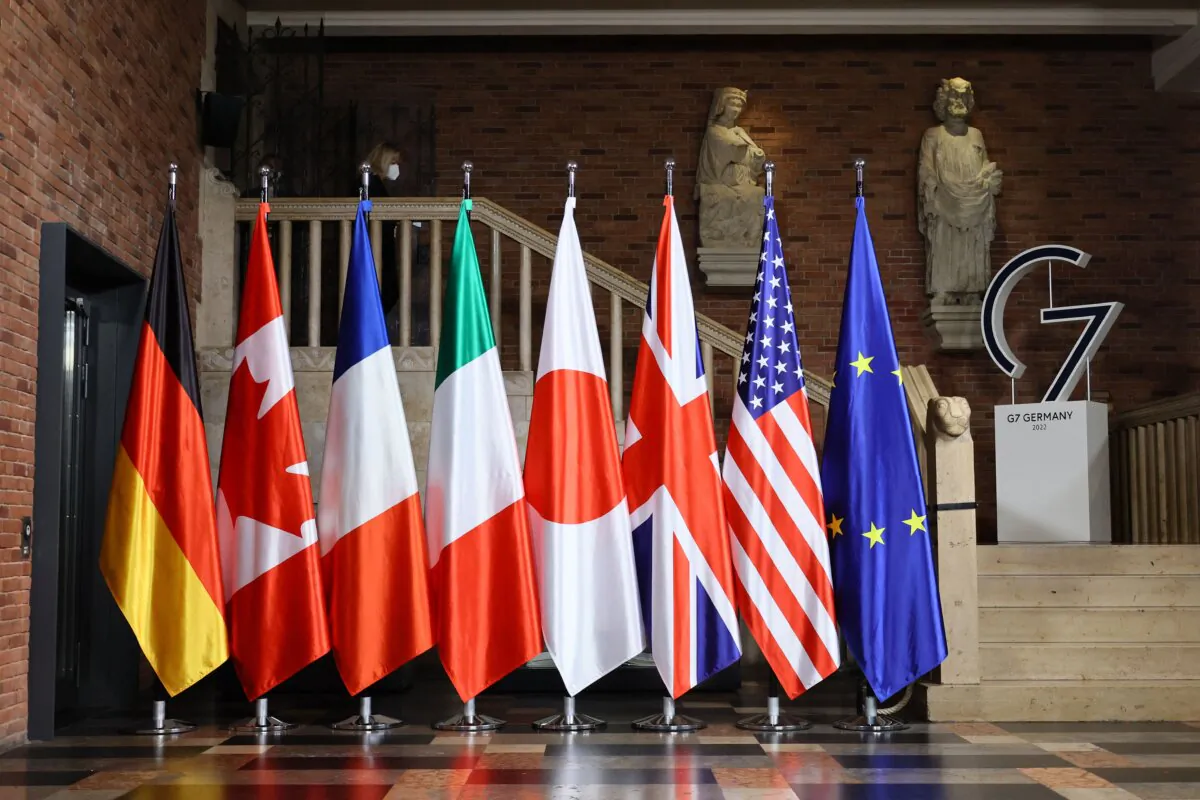 Flags of (L to R) Germany, Canada, France, Italy, Japan, Great Britain, United States, and the European Union are displayed for a G7 Foreign Ministers Meeting at the City Hall in Muenster, western Germany, on Nov. 3, 2022. (Wolfgang Rattay/Pool/AFP via Getty Images)