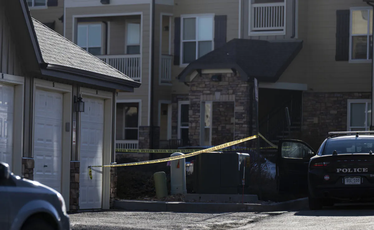 Police tape marks a crime scene where police found children dead inside a condo of the Palomino Ranch Point complex, on Dec. 19, 2023, in Colorado Springs, Colo. (Parker Seibold/The Gazette via AP)