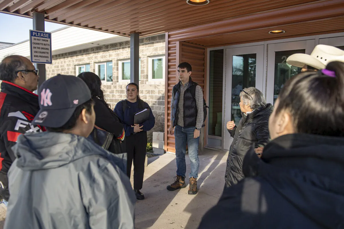 Keith Brown, the lawyer representing the James Smith Cree Nation, speaks with people as they enter the public coroner's inquest into the mass stabbings that happened on James Smith Cree Nation in 2022 in Melfort, Sask., on Jan. 31, 2024. (The Canadian Press/Liam Richards)