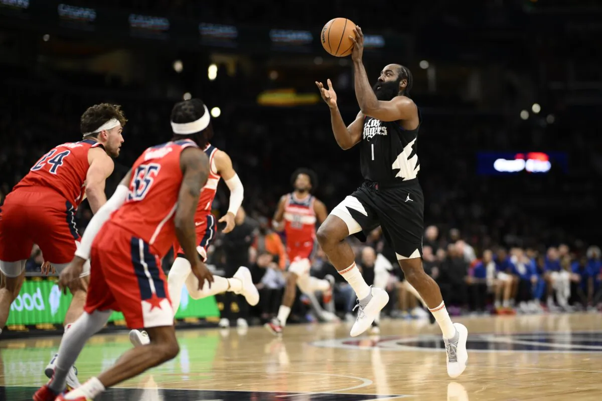 Los Angeles Clippers guard James Harden (1) passes the ball against Washington Wizards forward Corey Kispert (24) and guard Delon Wright (55) during the first half of an NBA basketball game in Washington on Jan. 31, 2024. (Nick Wass/AP Photo)
