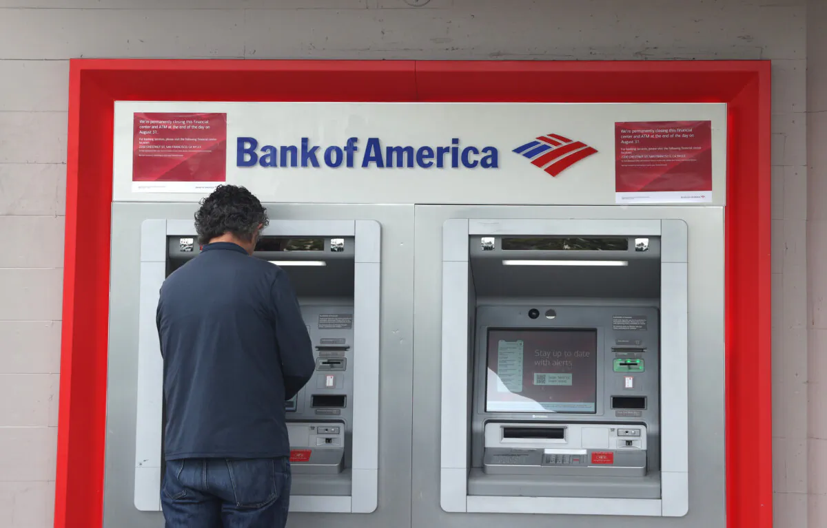 A customer uses an ATM at a Bank of America branch in San Francisco on July 14, 2021. (Justin Sullivan/Getty Images)