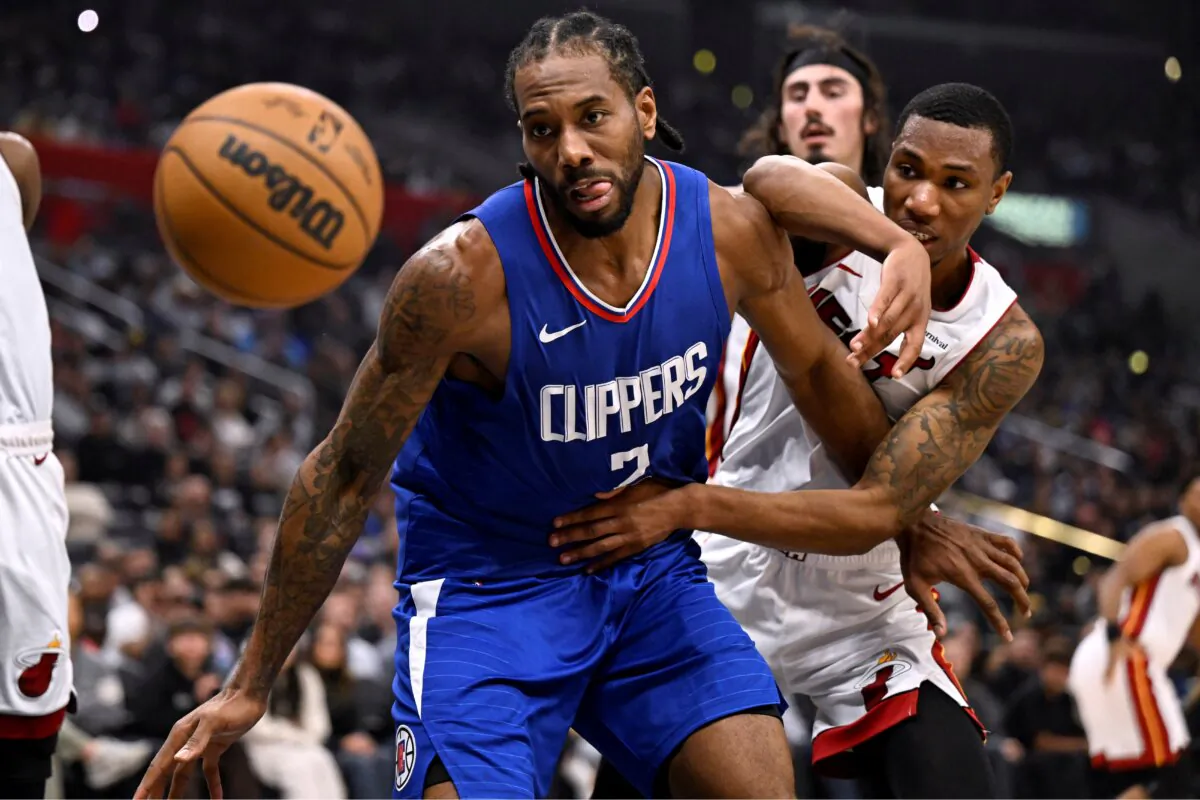Los Angeles Clippers forward Kawhi Leonard (2) keeps Miami Heat forward Jamal Cain, right, from the ball during the first half of an NBA basketball game in Los Angeles on Jan. 1, 2024. (Alex Gallardo/AP Photo)
