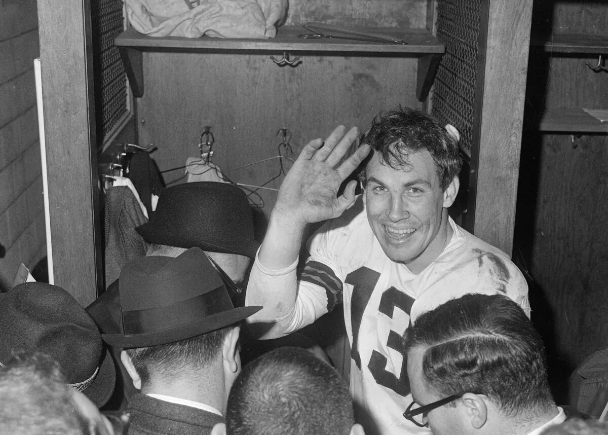 Cleveland Browns quarterback Frank Ryan gestures in the dressing room as he talks with reporters after the Browns defeated the Indianapolis Colts 27-0 in the NFL championship football game in Cleveland, Ohio, on Dec. 27, 1964. (AP Photo)