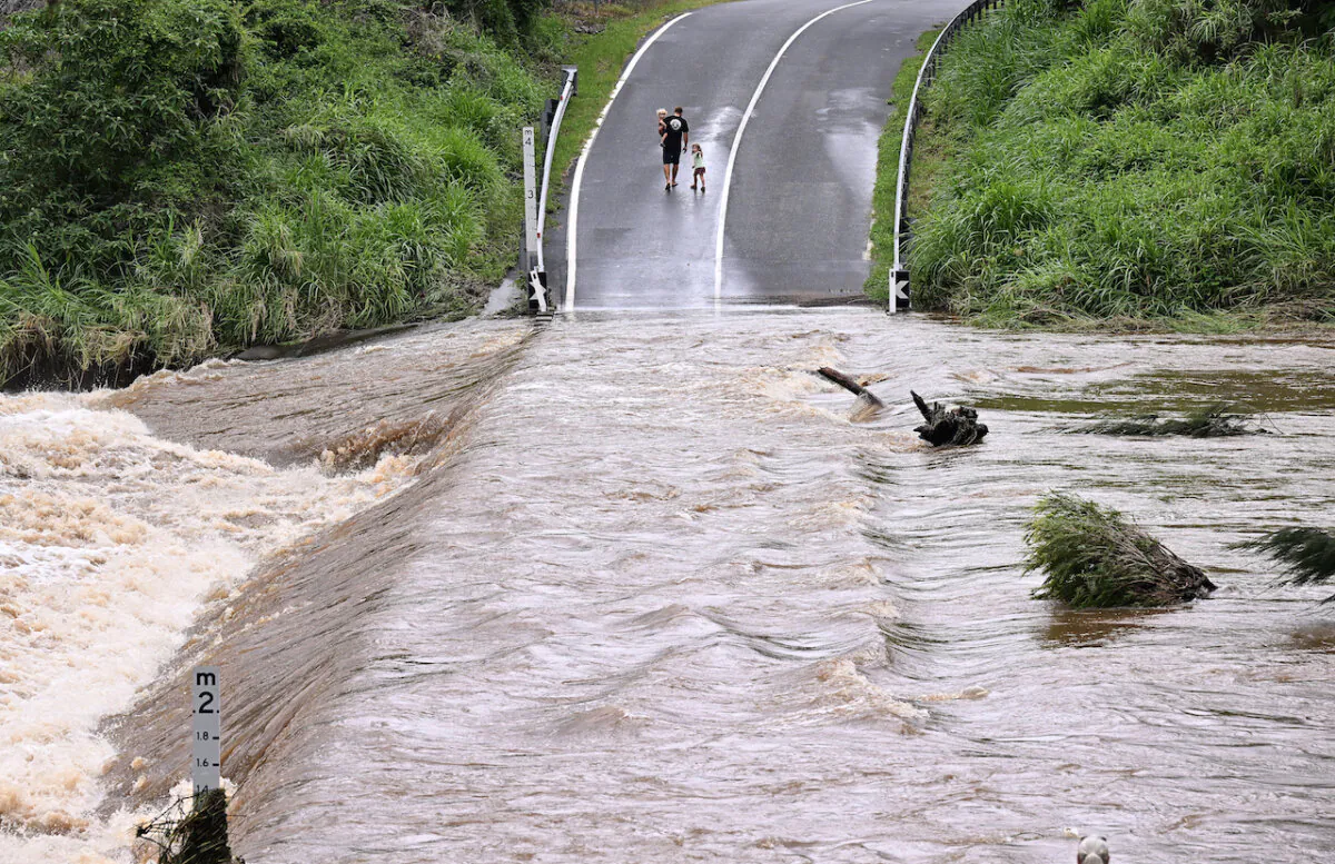 The Coomera river is seen cutting Clagiraba Road on the Gold Coast, in Queenland, Australia on Jan. 2, 2024. (AAP Image/Dave Hunt)