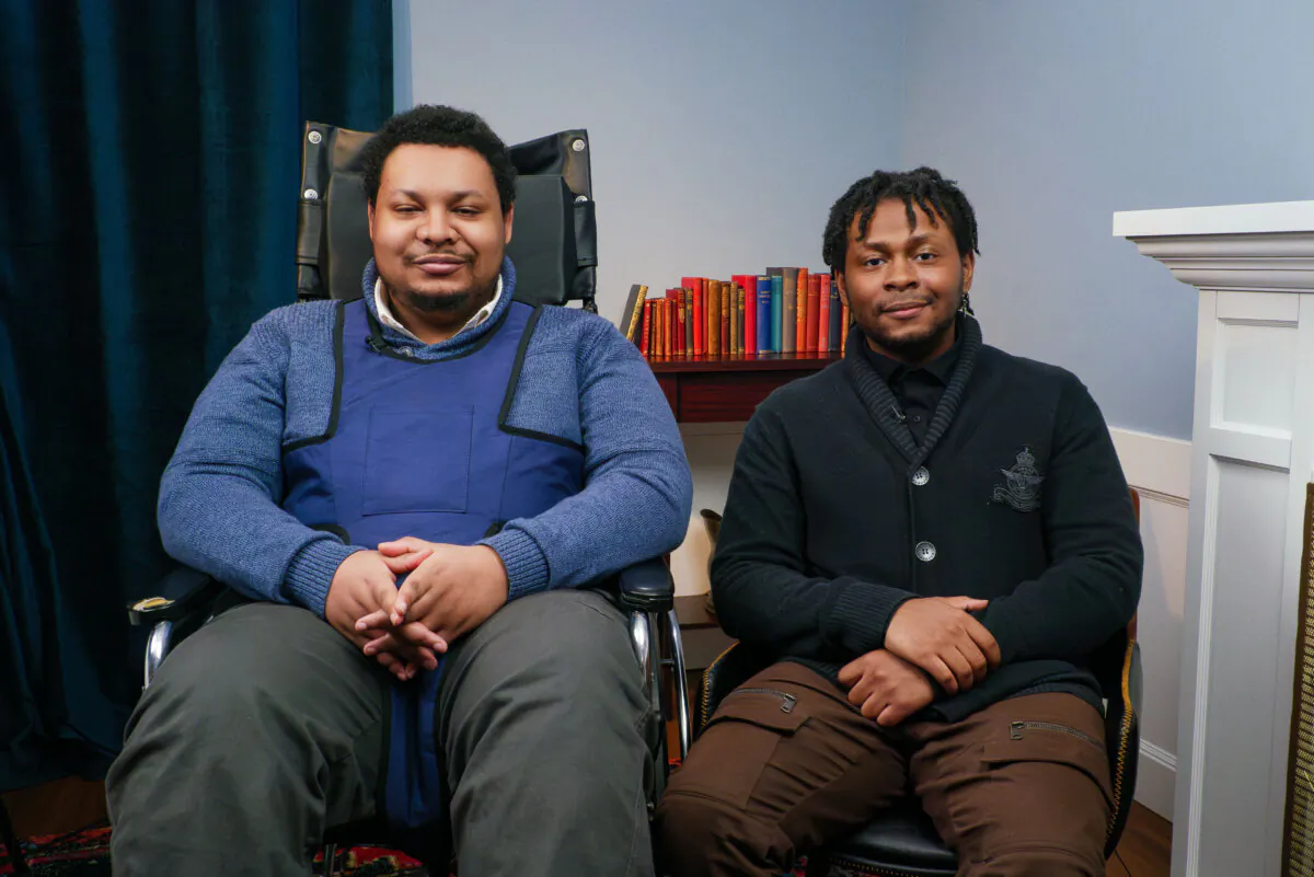 Andre Cherry, who was severely injured after his second Moderna vaccine shot, and his brother Christian Cherry, in Washington on Nov. 7, 2023. (Jack Hsu/The Epoch Times)