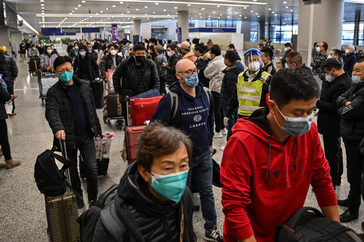 Passengers in the arrivals area for international flights at the Shanghai Pudong International Airport in Shanghai on Jan. 8, 2023. (Hector Retamal/AFP via Getty Images)