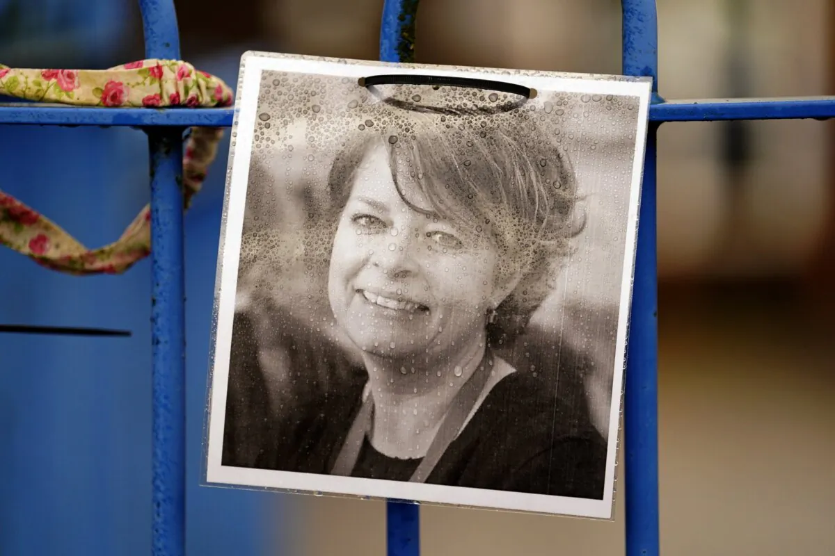 Photograph of Ruth Perry attached to the fence outside John Rankin Schools in Newbury, Berkshire on Dec. 7, 2023. (Andrew Matthews/PA Wire)