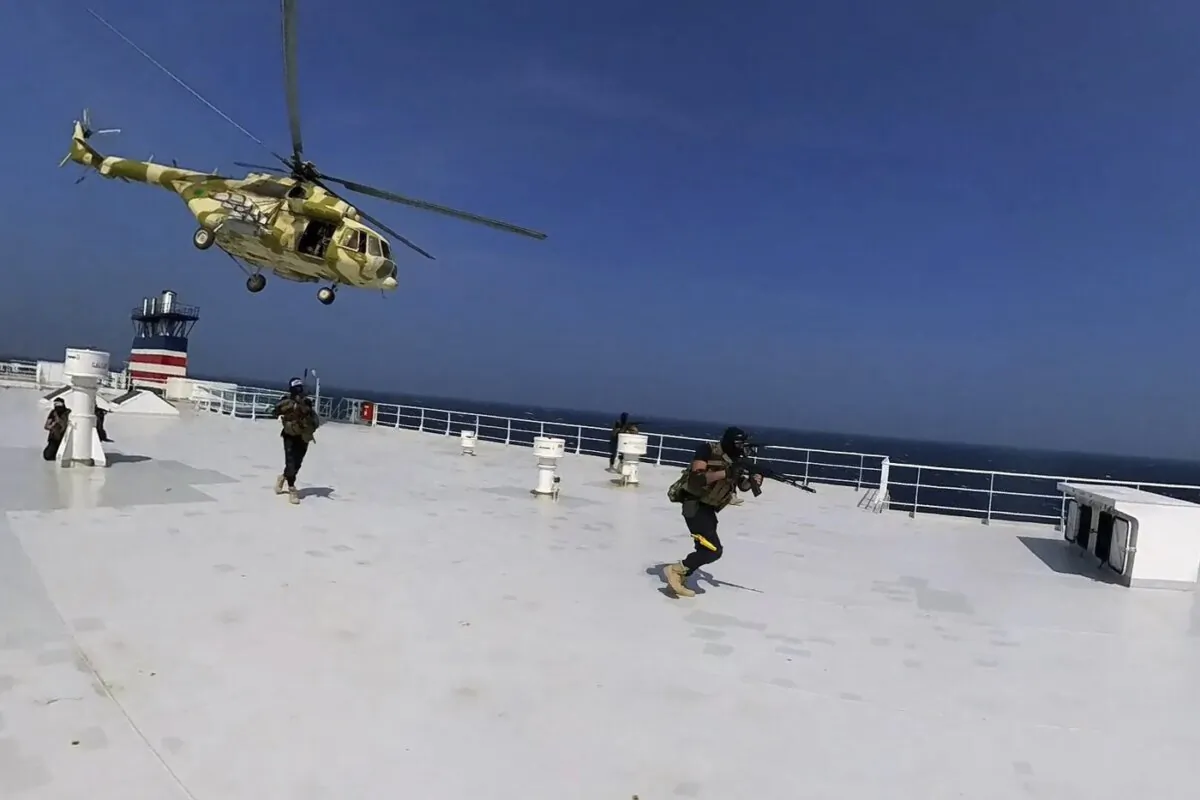 This photo released by the Houthi Media Center shows Houthi forces boarding the cargo ship Galaxy Leader on Nov. 19, 2023. (The Canadian Press/AP-HO, Houthi Media Center
AP Third Party)