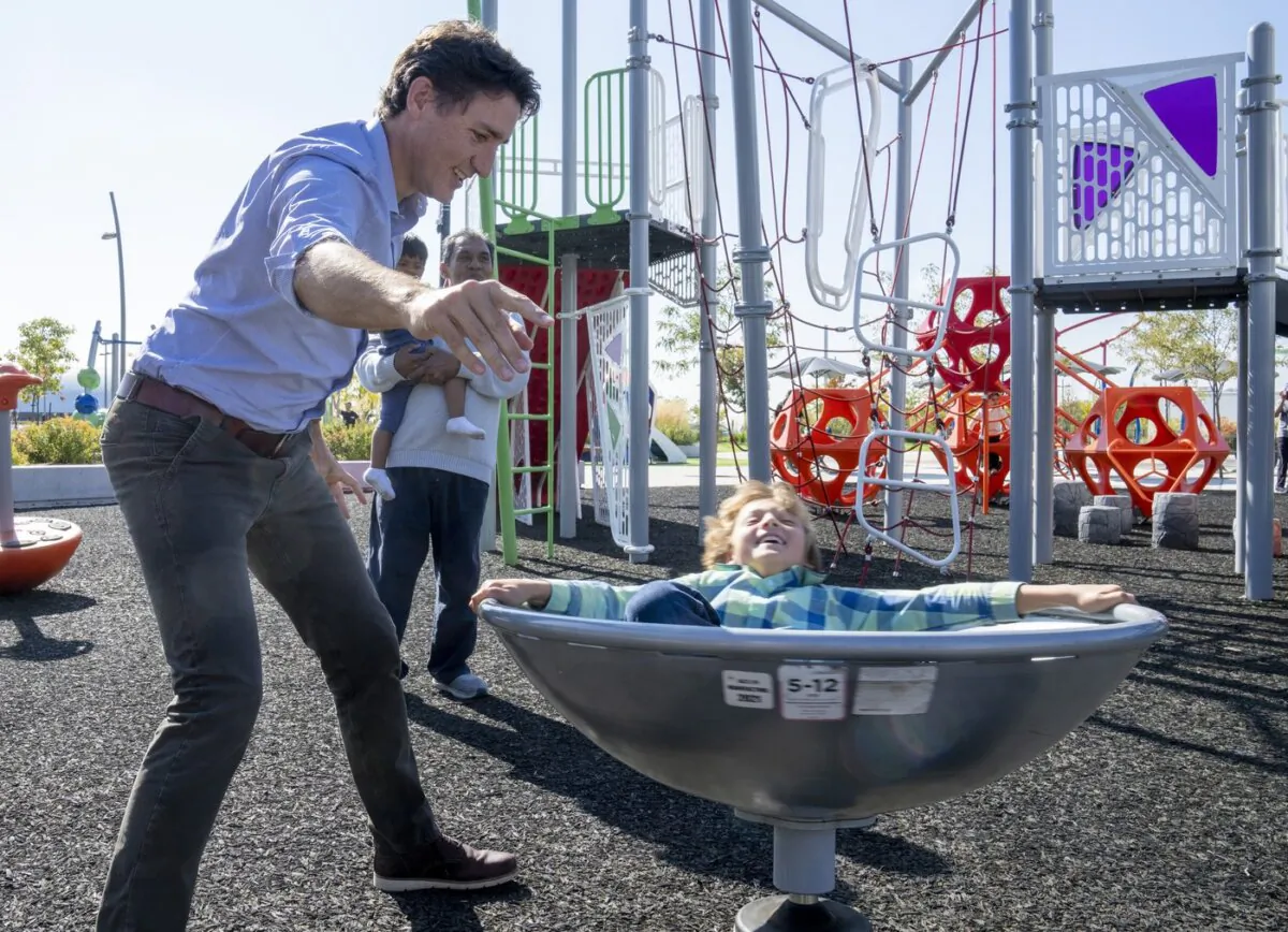 Prime Minister Justin Trudeau plays with his son Hadrien during a visit to Brampton, Ontario on Sept. 29, 2023. (The Canadian Press/Frank Gunn)